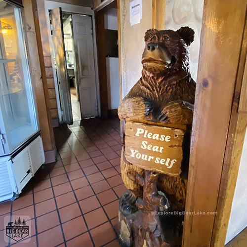 Breakfast_Thelmas_copyright_ExploreBigBearLake_dot_com_entryway carved bear