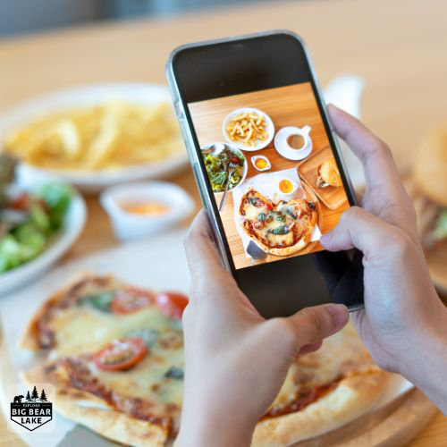 phone taking a photo of the food for restaurant review of dining options in big bear lake by ExploreBigBearLake-dot-com